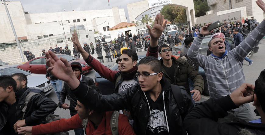 Students protest outside the Education Ministry premises in Amman on Sunday (Photo by Osama Aqarbeh)